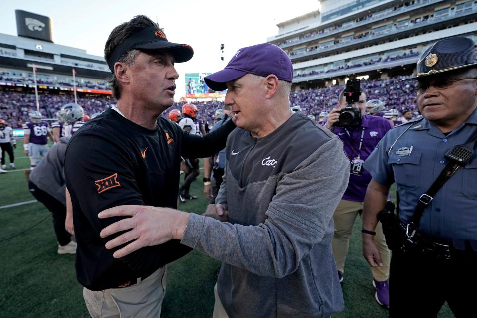 Kansas State coach Chris Klieman, right, and Oklahoma State coach Mike Gundy greet each other after the Wildcats' 48-0 win Oct. 29, 2022, in Manhattan, Kan.