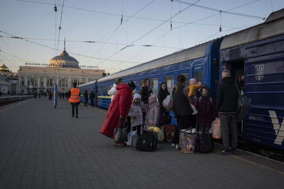 FILE - People embark a train in Odesa, southern Ukraine, on March 23, 2022. The Black Sea port is mining its beaches and rushing to defend itself from a Mariupol-style fate. Some Western officials believe the city, which is dear to Ukrainians' hearts, could be next. (AP Photo/Petros Giannakouris, File)