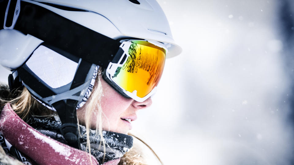 Close up of a skier wearing helmet and goggles