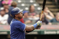 Kansas City Royals' Salvador Perez watches his two-run home run in the fifth inning in the first baseball game of a doubleheader against the Cleveland Indians, Monday, Sept. 20, 2021, in Cleveland. The home run broke Johnny Bench's record for the most home runs in a season by a primary catcher. (AP Photo/Tony Dejak)