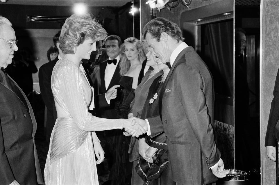 <p>Diana, by then an old pro at attending James Bond premieres, greeted Roger Moore. </p>