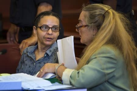 Yoselyn Ortega (L), nanny who is accused of killing Lucia and Leo Krim, ages 6 and 2 respectively, arrives for a hearing for her trial at Manhattan Supreme Court in New York, July 8, 2013. Ortega was discovered with the two children and a knife as she attempted to slit her own throat but was discovered by the children's mother, Marina Krim, who was returning home with her 3-year-old daughter. REUTERS/Lucas Jackson