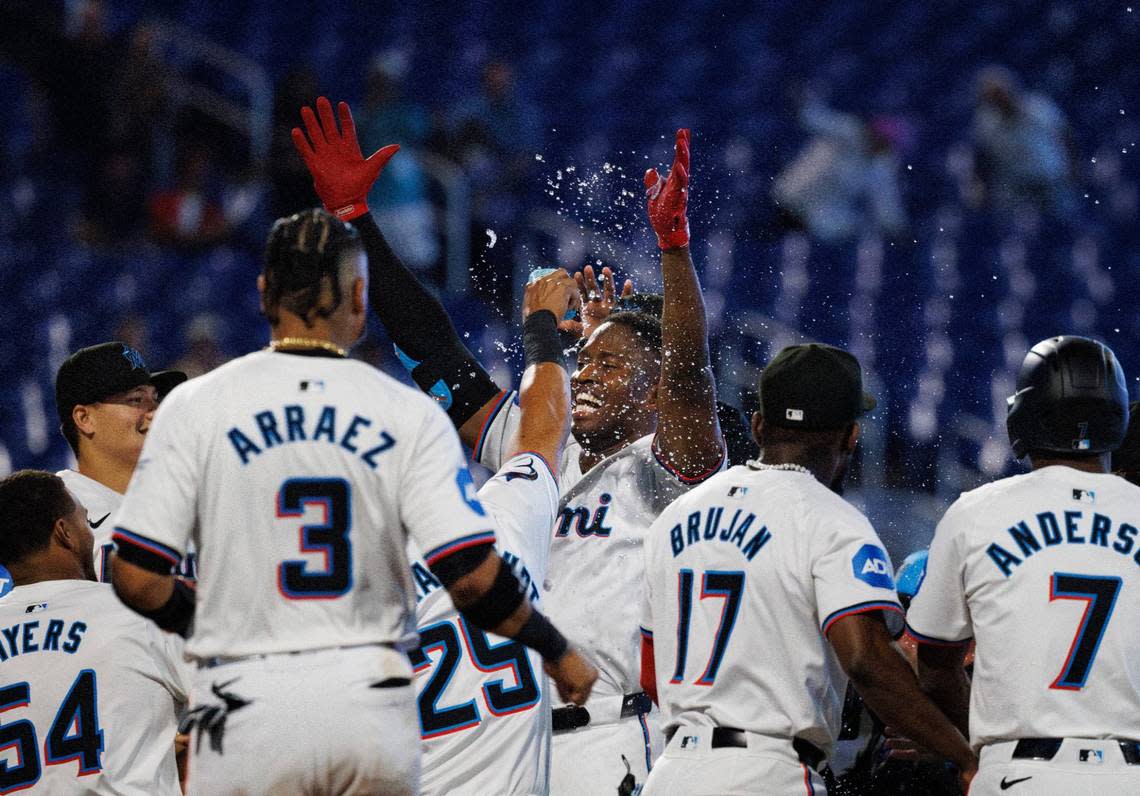 Miami Marlins outfielder Jesús Sánchez (12) smiles in celebration after winning the game with a walk-off single during the tenth inning of a baseball game on Thursday, May 2, 2024, at loanDepot Park in Miami, Fla.