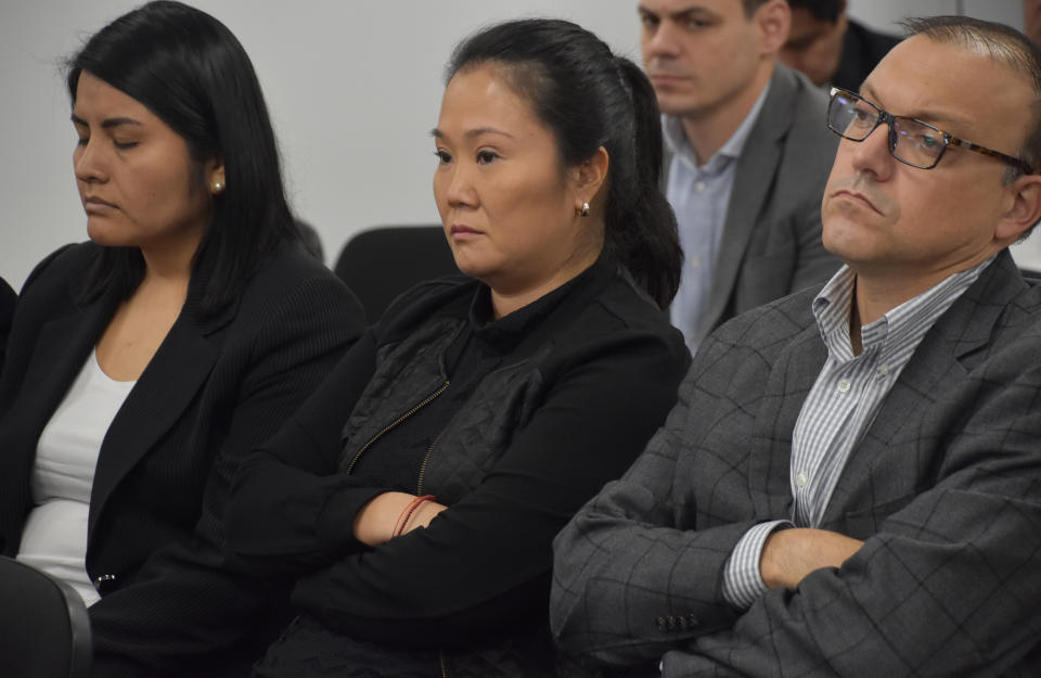 In this photo provided by Peru's Supreme Court communications office, former Peruvian first daughter Keiko Fujimori sits in court where Judge Richard Concepcion ruled that she should be detained as a preventative measure while prosecutors investigate allegations she led a criminal network within her party that received about $1 million in payments from Brazilian construction giant Odebrecht, in Lima, Peru, Wednesday, Oct. 31, 2018. Keiko Fujimori denies she accepted money from Odebrecht during her 2011 presidential run and has called the investigation a political witch hunt. (Peru's Supreme Court communication office via AP)