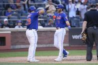 New York Mets' Jeff McNeil, right, is greeted by DJ Stewart after McNeil hit a two-run homer during the fifth inning of a baseball game against the Arizona Diamondbacks at Citi Field, Thursday, Sept. 14, 2023, in New York. (AP Photo/Seth Wenig)