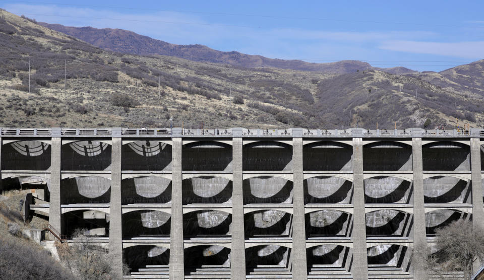 FILE - This Nov. 7, 2019, photo shows the Mountain Dell Dam, east of Salt Lake City. U.S. Sen. Kirsten Gillibrand, D-N.Y., is proposing Tuesday, Dec. 17, 2019, to boost federal efforts to fortify the nation's dams following an Associated Press investigation that found scores of potentially troubling dams around the country. (AP Photo/Rick Bowmer, File)