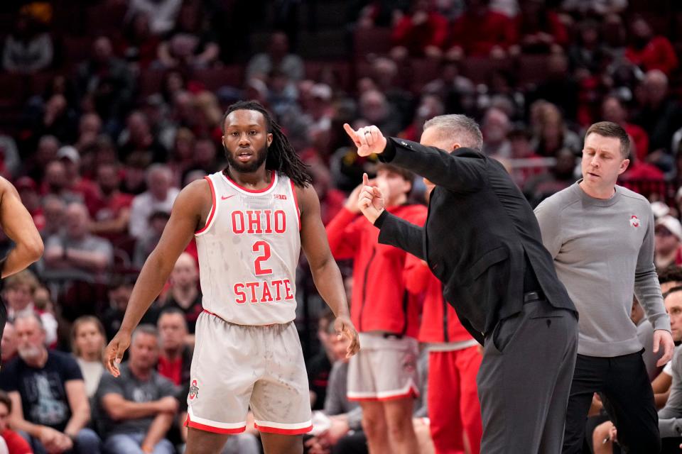 Mar 1, 2023; Columbus, Ohio, United States;  Ohio State Buckeyes guard Bruce Thornton (2) speaks with head coach Chris Holtmann during the first half of the NCAA Division I basketball game between the Ohio State Buckeyes and the Maryland Terrapins at Value City Arena on Wednesday night. Mandatory Credit: Joseph Scheller-The Columbus Dispatch