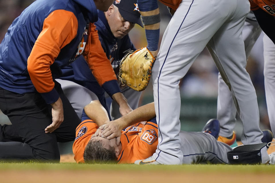 Houston Astros' Jake Odorizzi (17) is tended to on the mound after the fifth inning of a baseball game against the Boston Red Sox, Monday, May 16, 2022, in Boston. (AP Photo/Steven Senne)