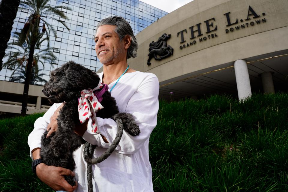 Will Sens, with his dog Tootsie, is formerly homeless and lived at The LA Grand, a temporary hotel shelter in downtown Los Angeles that is part of Mayor Karen Bass' Project Roomkey. After living there for two years, Sens now has a studio apartment he shares with a roommate.