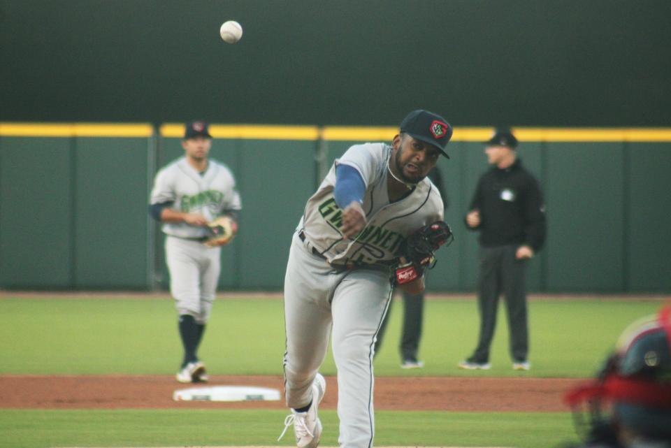 Gwinnett pitcher Darius Vines delivers a warm-up pitch against the Jacksonville Jumbo Shrimp during opening day of the 2024 Triple-A season.