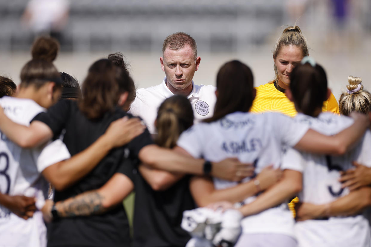 LOUISVILLE, KY - JUNE 20: Racing Louisville FC head coach Christy Holly gathers with his players following a win against the Houston Dash during a game between Houston Dash and Racing Louisville FC at Lynn Family Stadium on June 20, 2021 in Louisville, Kentucky. (Photo by Joe Robbins/ISI Photos/Getty Images)