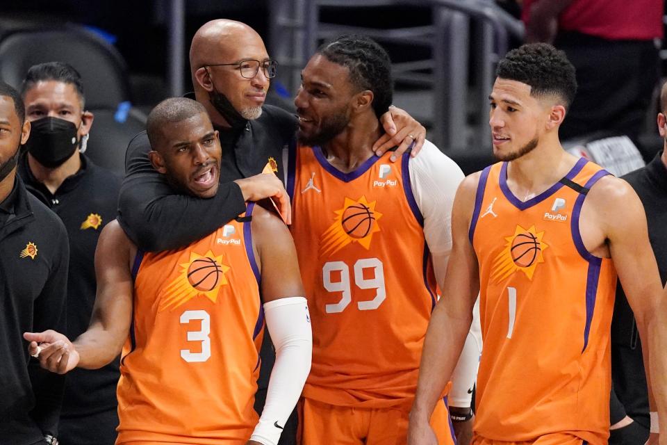 Monty Williams (second from left) gave a simple pep talk before his Phoenix Suns beat the Milwaukee Bucks in Game 1 of the NBA Finals, 118-105: “Go hoop; ya’ll know what to do.”