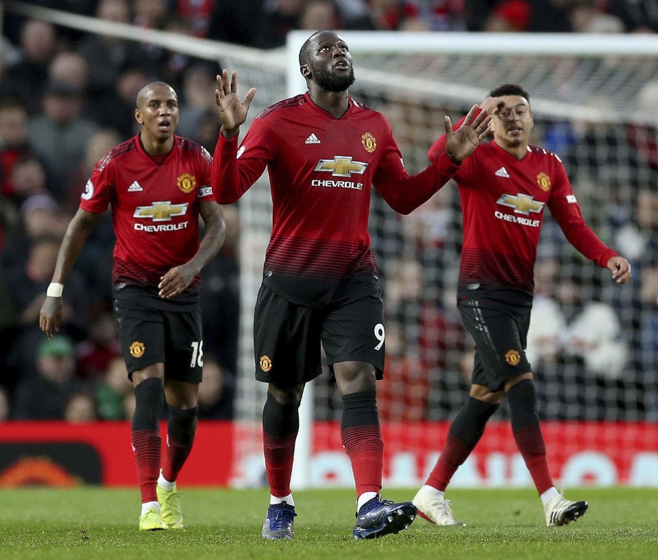 Manchester United's Romelu Lukaku, center, celebrates scoring his side's third goal of the game during their English Premier League soccer match against Fulham at Old Trafford, Manchester, England, Saturday, Dec. 8, 2018. (Barrington Coombs/PA via AP)