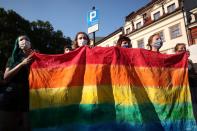 People take part in a rally in support of the LGBT community in Krakow