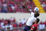 United State´s Gyasi Zardes, top, and Panama's Eric Davis head for the ball during a qualifying soccer match for the FIFA World Cup Qatar 2022 at Rommel Fernandez stadium, Panama city, Panama, Sunday, Oct. 10, 2021. (AP Photo/Arnulfo Franco)