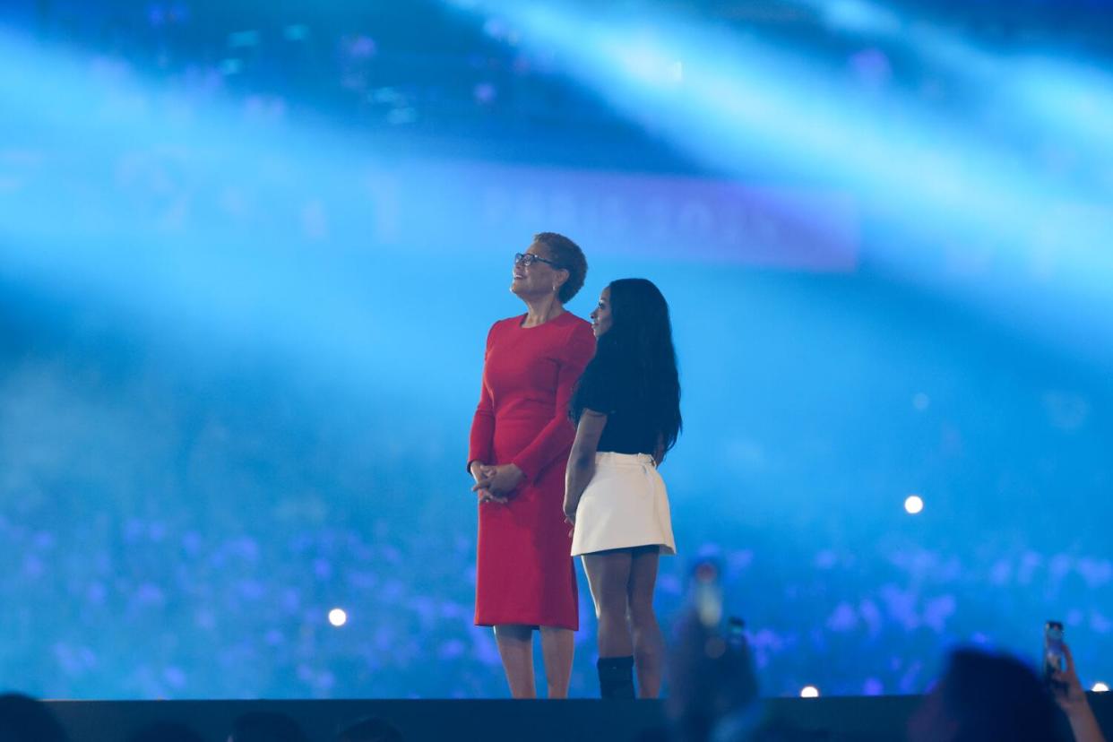 L.A. Mayor Karen Bass and U.S. gymnast Simone Biles stand during the 2024 Paris Olympics closing ceremony