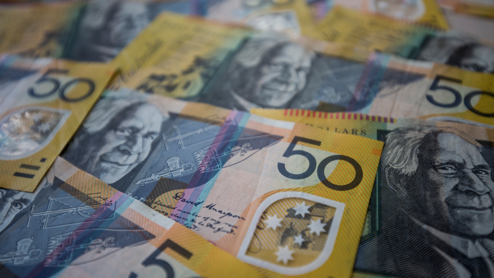 Close up image of Australian $50 notes. 