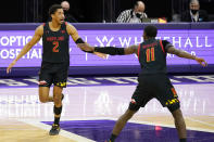 Maryland guard Aaron Wiggins, left, celebrates with guard Darryl Morsell after making a three-point basket against Northwestern during the second half of an NCAA college basketball game in Evanston, Ill., Wednesday, March 3, 2021. Northwestern won 60-55.(AP Photo/Nam Y. Huh)