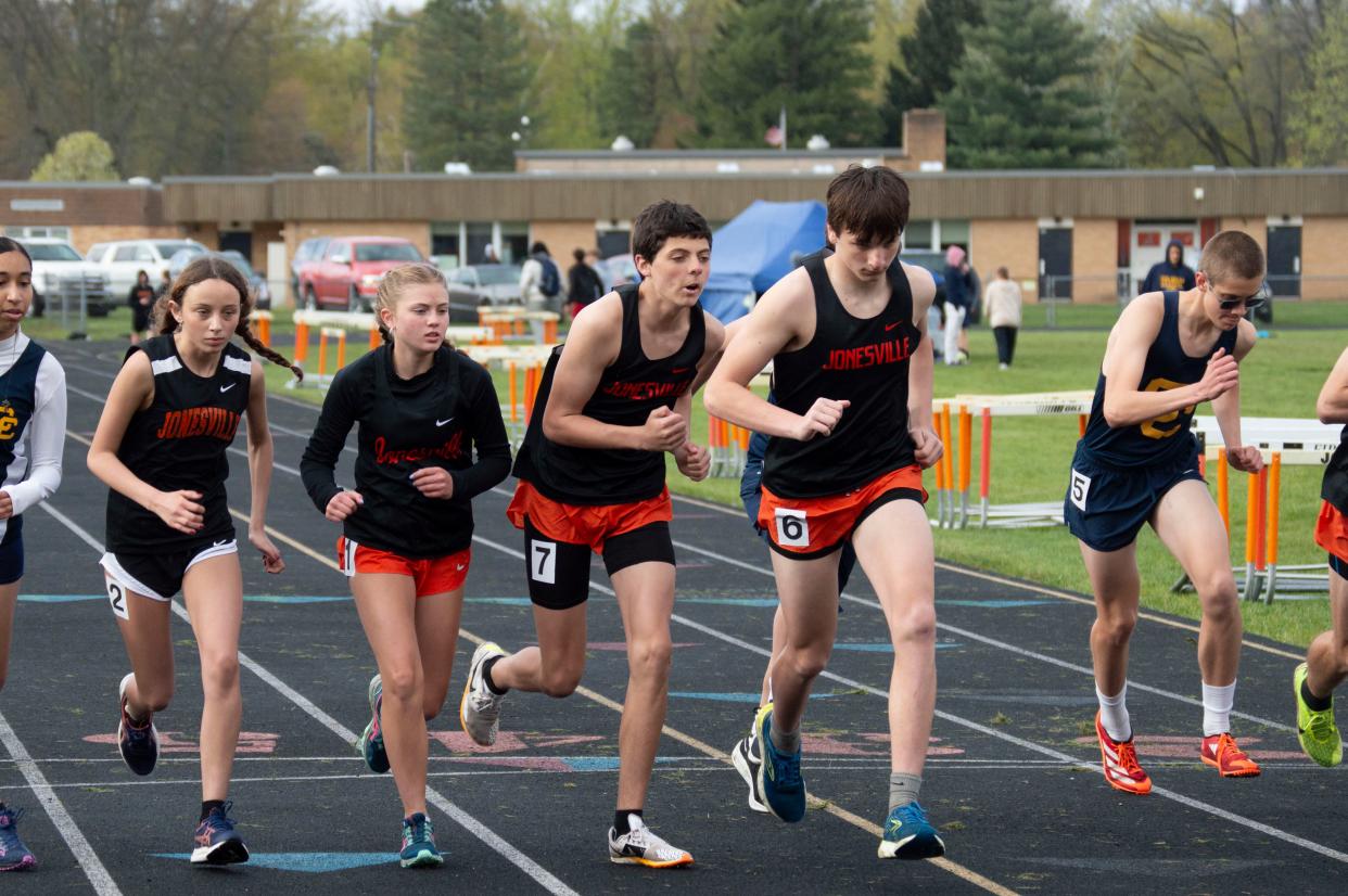 Jonesville 800-meter dash runners kick off their race, where freshman Caleb Blonde won for the boys and freshman Kendahl Drake won for the girls Comet track teams.