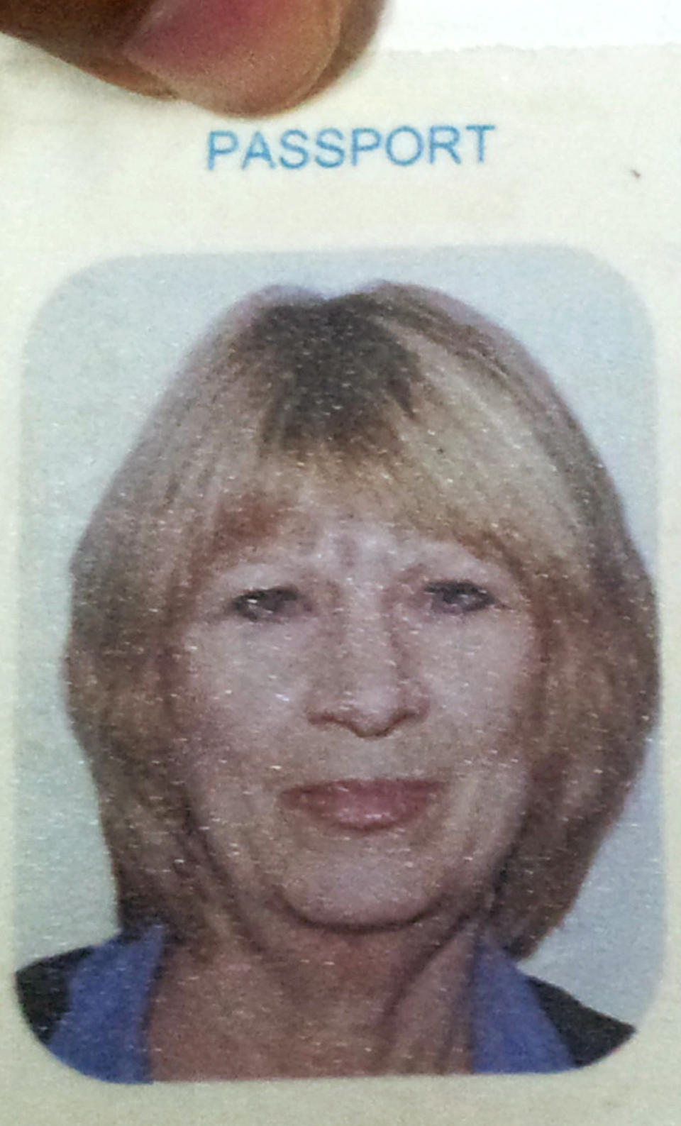 In this photo taken from a passport shown at a police station in Phuket, Thailand, Wednesday, June 20, 2012, Australian tourist Michelle Elizabeth Smith is shown. Thai police arrested two Thai suspects in the slaying of Smith, 60, who was stabbed to death when she resisted an attempt by the men on a motorcycle to snatch her bag on Thailand's resort island of Phuket on June 20. They admitted to the crime Tuesday, June 26, saying they only meant to slash her pocketbook strap and never meant to stab her. Smith was among 11 people from Perth who traveled to the island on a survey trip for their travel agency. (AP Photo) EDITORIAL USE ONLY