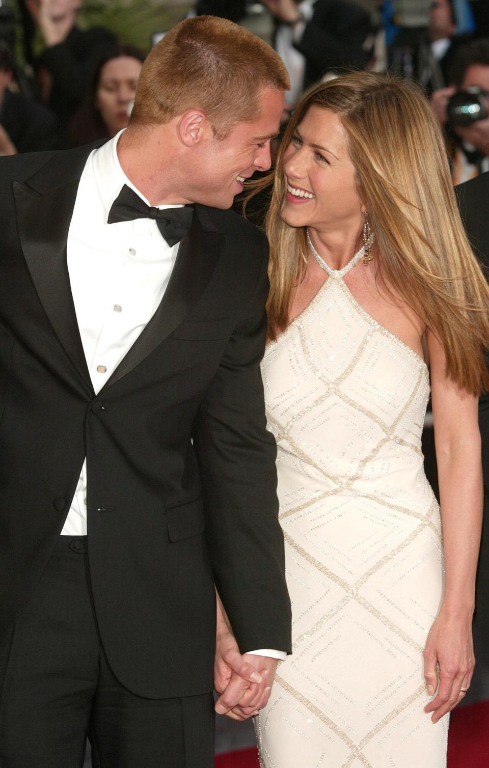 Brad Pitt and wife actress Jennifer Aniston attend the World Premiere of the epic movie &quot;Troy&quot; at Le Palais de Festival on May 13, 2004 in Cannes, France