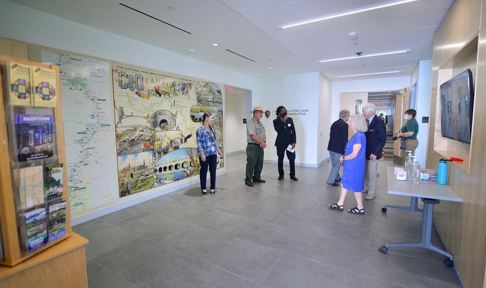 Visitors tour the lobby of the new C and O Canal headquarters in Williamsport following a ribbon cutting ceremony Wednesday. The public will have access to the lobby and a meeting room.