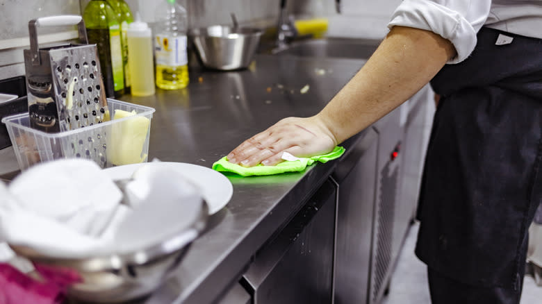 Chef scrubbing a professional kitchen