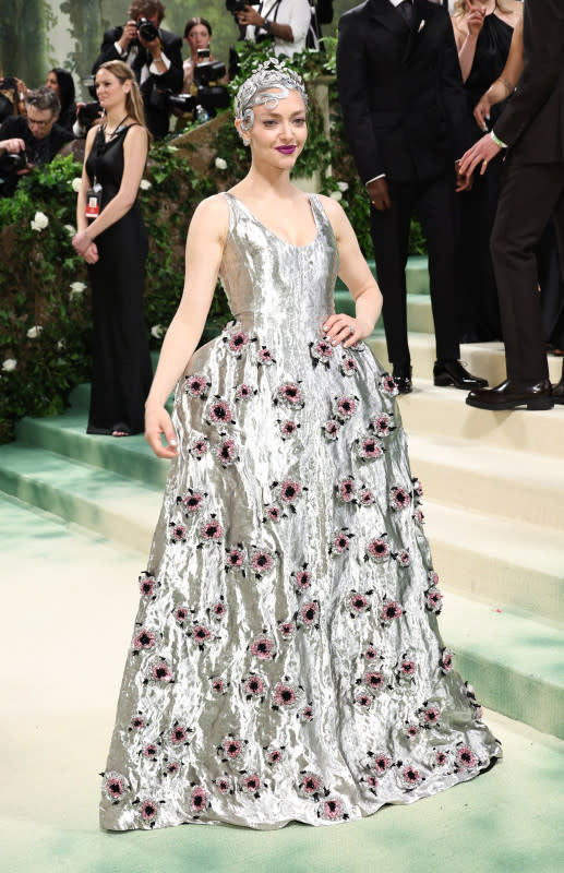 <p>Jamie McCarthy/Getty Images</p><p>The actor wore this silver gown and headpiece, bedecked with a number of tiny pink flowers. </p>