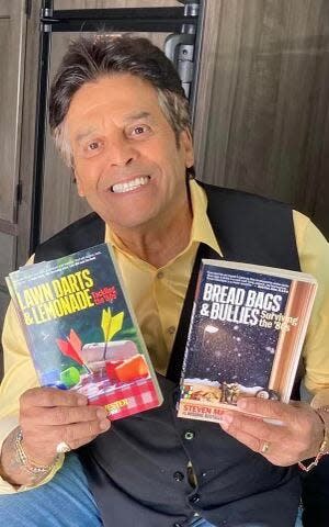 Actor Erik Estrada holds two of author Steven Manchester's books, which are coming-of-age stories set in 1980s Greater Fall River.