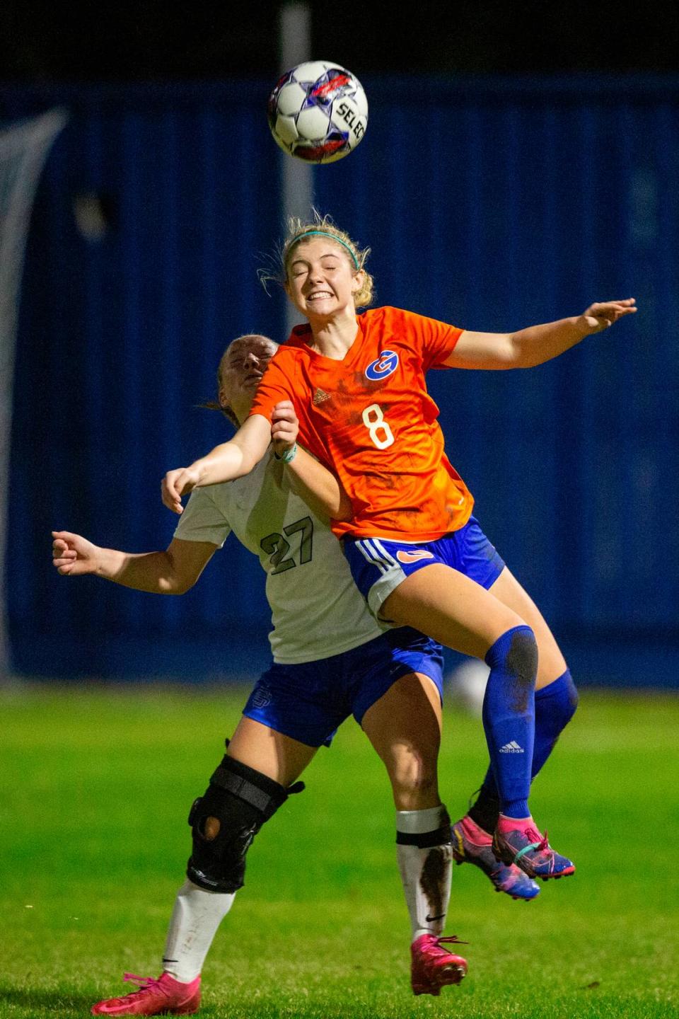 Gulfport’s Chloe Brock heads the ball away from Ocean Springs’ Jaylen Bodry during the 6A South State Championship game in Gulfport on Tuesday, Jan. 31, 2023.