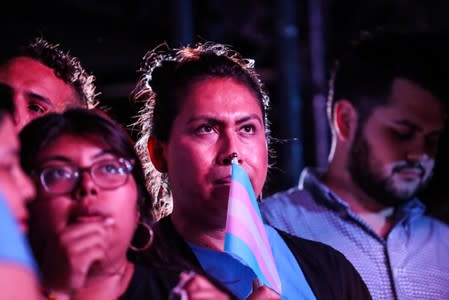 Supporters watch on screen during an election night event in the Queens borough of New York City