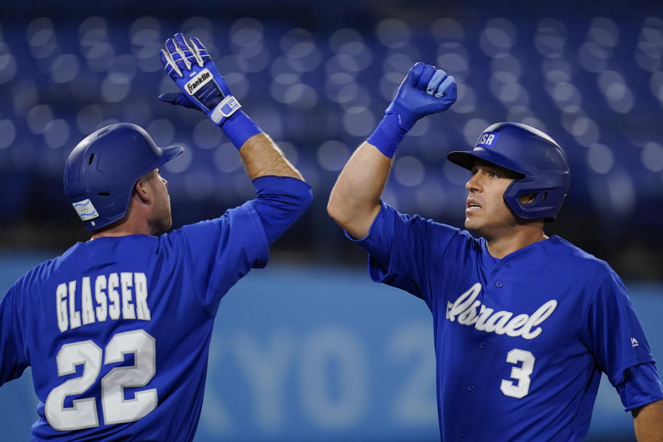 Israel's Ian Kinsler (3) celebrates with Mitchell Glasser after hitting a home run in the third inning of a baseball game against South Korea at the 2020 Summer Olympics, Thursday, July 29, 2021, in Yokohama, Japan. (AP Photo/Sue Ogrocki)