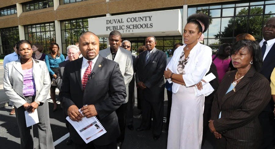 Political leaders joined with Schott Foundation CEO John H. Jackson (front left) in a news conference in 2010