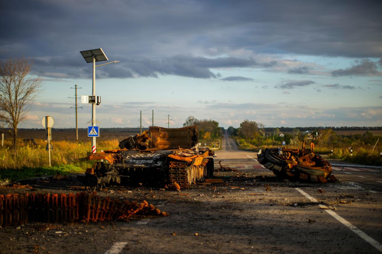 Remains of a destroyed Russian tank are scattered on the ground along the road between Izium and Kharkiv, Ukraine, Monday, Oct. 3, 2022. 