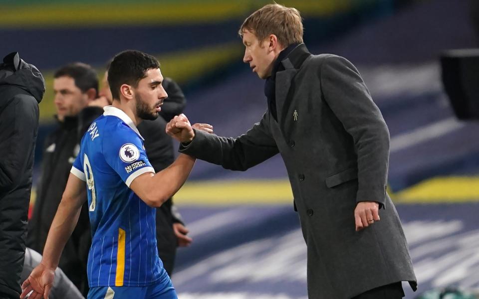 Brighton and Hove Albion's Neal Maupay bumps arms with manager Graham Potter - PA