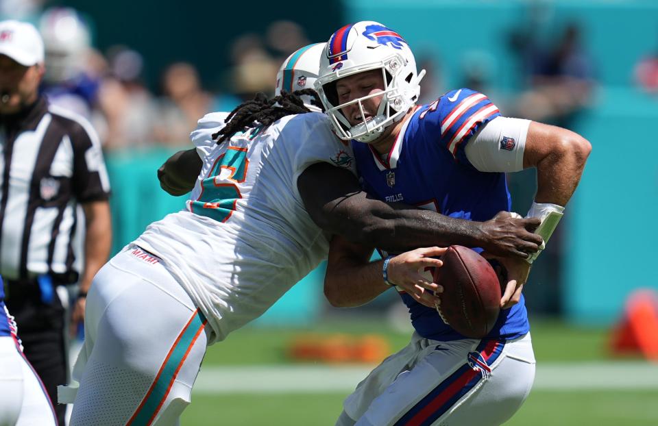 Miami Dolphins linebacker Melvin Ingram (6) sacks Buffalo Bills quarterback Josh Allen causing a fumble in the first half of an NFL game at Hard Rock Stadium in Miami Gardens, Sept. 25, 2022.