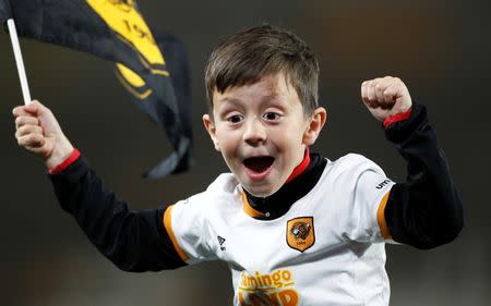 Britain Football Soccer - Hull City v Derby County - Sky Bet Football League Championship Play-Off Semi Final Second Leg - The Kingston Communications Stadium - 17/5/16 A young Hull fan celebrate on the pitch after reaching the Sky Bet Football League Championship Play-Off Final Action Images via Reuters / Craig Brough