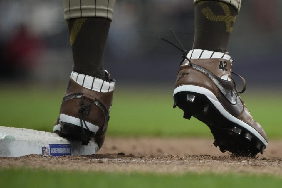 San Diego Padres' Fernando Tatis Jr. wears cleats for Jackie Robinson Day during the sixth inning of a baseball game against the Milwaukee Brewers Monday, April 15, 2024, in Milwaukee. (AP Photo/Morry Gash)