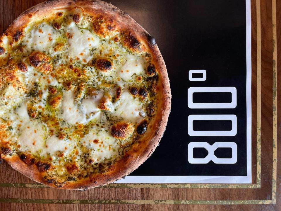 The Bianca Pizza from 800° Woodfired Kitchen is a white pie (no sauce), with parmigiano, mozzarella, garlic, oregano and EVOO.