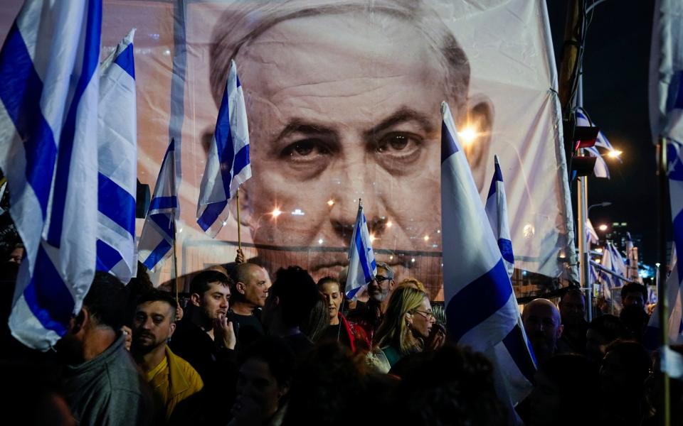 Israelis protest against plans by Prime Minister Benjamin Netanyahu's government to overhaul the Israel's judicial system in Tel Aviv in March - Ohad Zwigenberg/AP