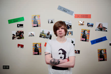 Vitaly Bespalov, 26, journalist and supporter of presidential candidate Ksenia Sobchak, poses for a picture, showing a tattoo depicting Sobchak on his arm, in St. Petersburg, Russia, February 14, 2018. "I am 26. Eighteen of those years, all of my conscious life, I have lived under a single president," said Bespalov. "I have been waiting too long for change." REUTERS/Anton Vaganov