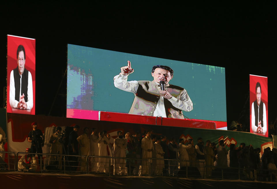 Pakistani opposition leader Imran Khan, addresses his party supporters during a rally in Peshawar, Pakistan, Tuesday, Sept. 6, 2022. Since he was toppled by parliament five months ago, former Prime Minister Imran Khan has demonstrated his popularity with rallies that have drawn huge crowds and signaled to his rivals that he remains a considerable political force. (AP Photo/Mohammad Sajjad)