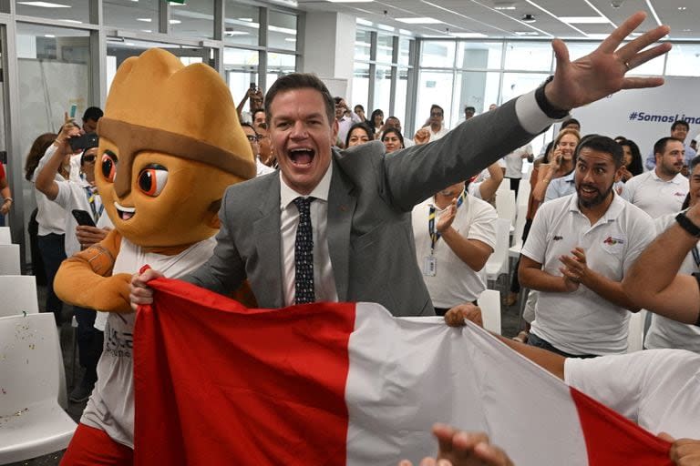 Carlos Zegarra (C), Executive Director of the Legado (legacy in Spanish) corporation, which manages the infrastructure left by the Pan-American Games 2019, reacts in Lima to the voting results that chose Lima over Asuncion, Paraguay, on March 12, 2024, as the host of the upcoming Pan-American Games 2027. Lima was elected to host the 2027 Pan American Games at an Extraordinary General Assembly of Panam Sports held in Miami. 