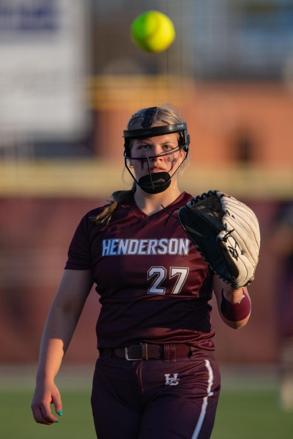 Henderson County’s Anna Kemp (27) catches the ball back at the pitcher’s mound during the Colonels’ game against the Castle Knights in Henderson, Ky., Tuesday afternoon, April 11, 2023. 