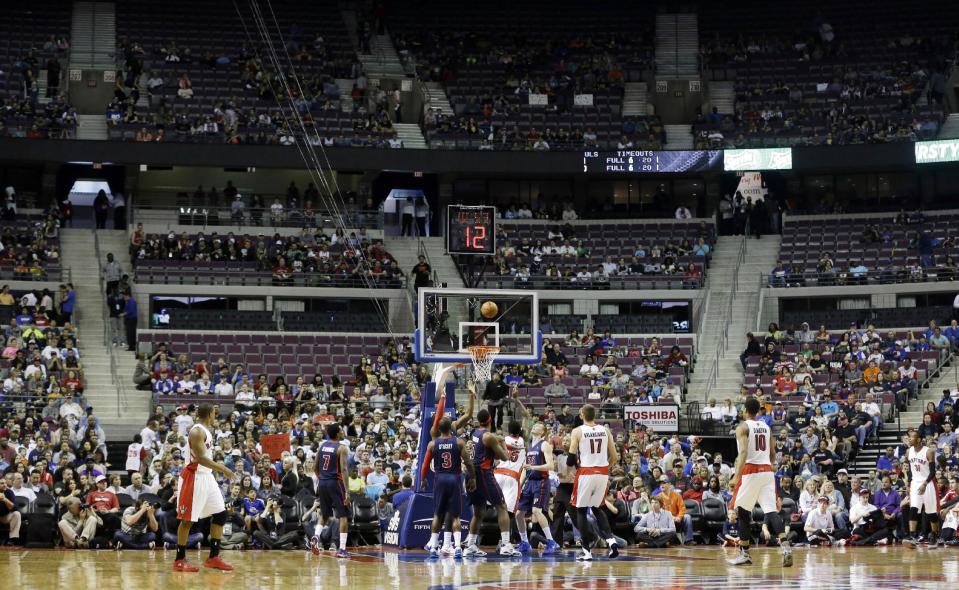 Empty seats are seen during the first half of an NBA basketball game between the Detroit Pistons and the Toronto Raptors in Auburn Hills, Mich., Sunday, April 13, 2014. (AP Photo/Carlos Osorio)