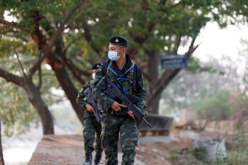 Thai border guards walk a they patrol at Myanmar border in Mae Sot