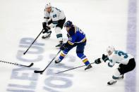 zMay 21, 2019; St. Louis, MO, USA; St. Louis Blues right wing Vladimir Tarasenko (91) controls the puck while defended by San Jose Sharks right wing Timo Meier (top) and center Logan Couture (right) during the second period in game six of the Western Conference Final of the 2019 Stanley Cup Playoffs at Enterprise Center. Mandatory Credit: Billy Hurst-USA TODAY Sports