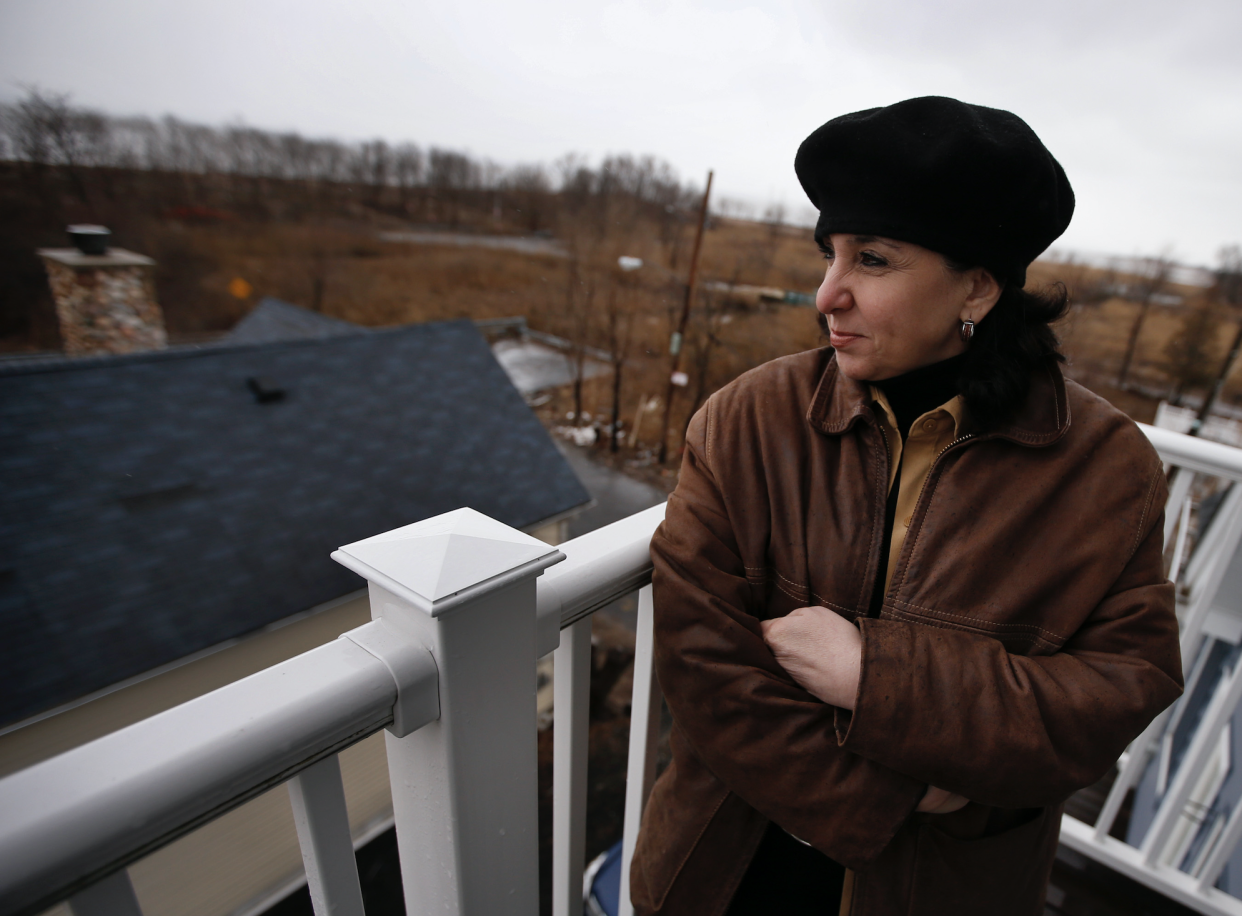 Tina Downer stands on the third floor balcony of her home overlooking the Atlantic Ocean in the Oakwood Beach section of Staten Island in New York City, New York, March 25, 2013. (Photo: Reuters)