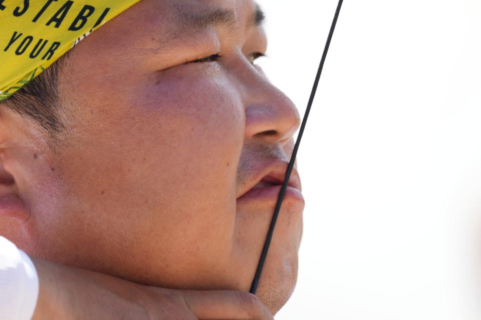 Woojin Kim (KOR) competes in the men's individual archery ranking round during the Tokyo 2020 Olympic Summer Games at Yumenoshima Archery Field on July 23, 2021. 