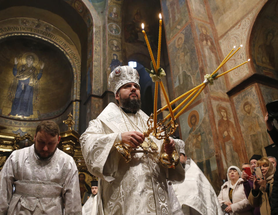 Metropolitan Epiphanius, the head of the independent Ukrainian Orthodox Church, leads the Christmas service in the St. Sophia Cathedral in Kiev, Ukraine, Monday, Jan. 7, 2019. (AP Photo/Efrem Lukatsky)